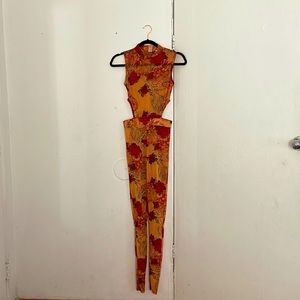 Fashion Nova See through jumpsuit. Cut on the sides and fits like a glove.